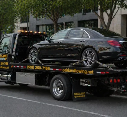 luxury car sedan towing by oakland towing